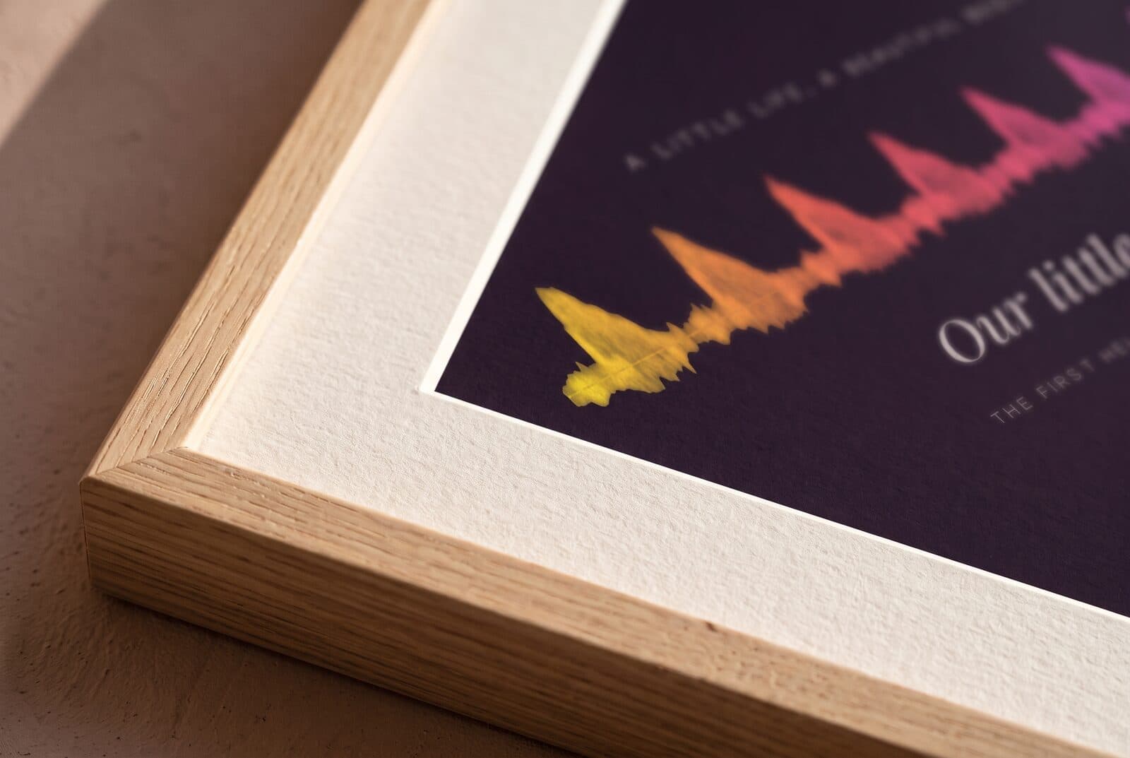 Close-up of a heartbeat print on textured fine-art paper